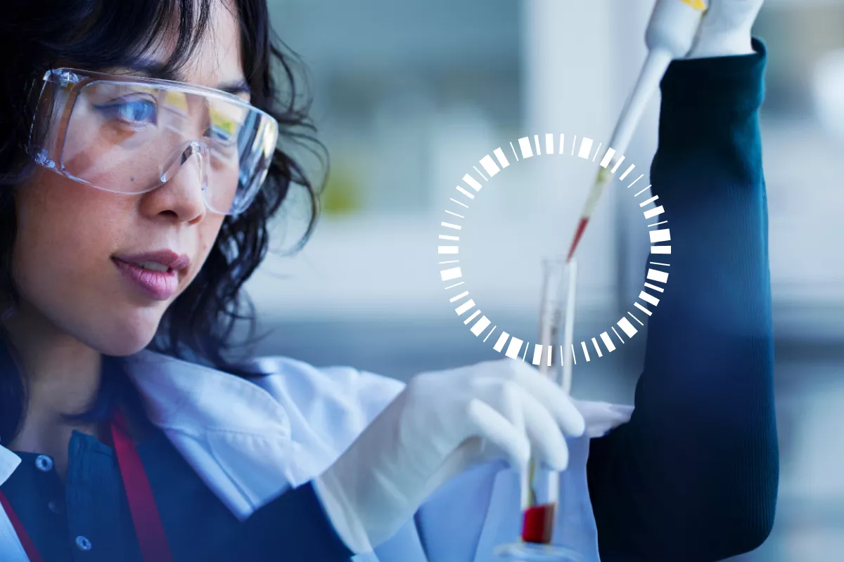 Scientist holding a pipette to a sample tube with red liquid. There is a circle icon around the opening on the vail